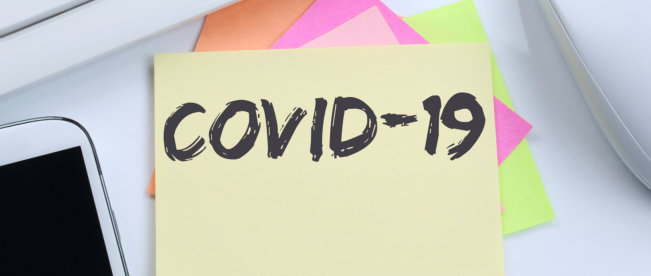 covid-19 text written on a paper